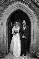 Nikki and Toby in the doorway at the Holy Cross church, Axminster.