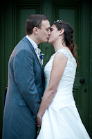 Rachel and Andy kiss in front of the River Cottage Door