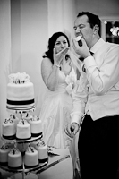 Rachel and Ben eating their wedding cake